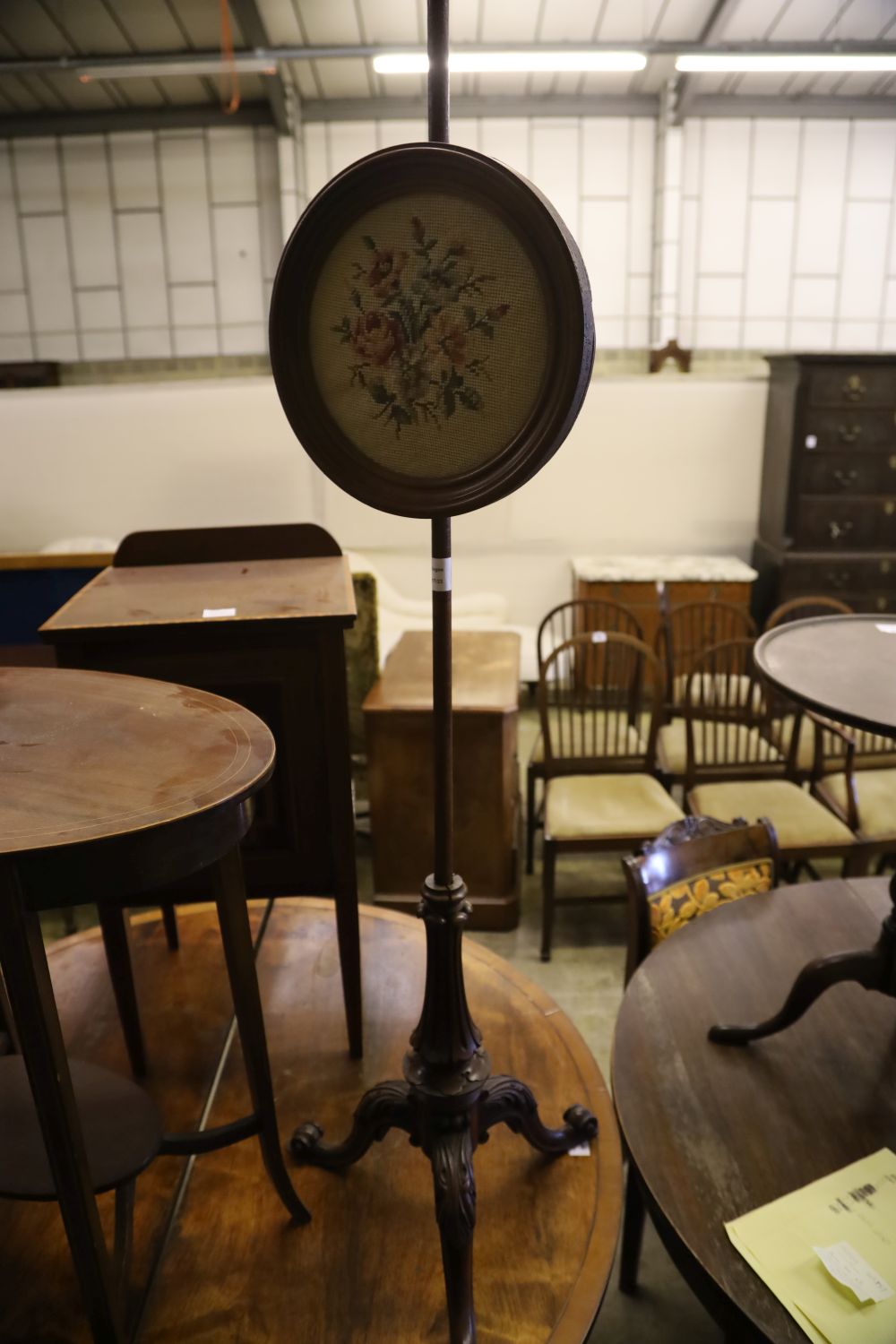 An Edwardian mahogany pot cupboard, an oval occasional table and a Victorian pole screen